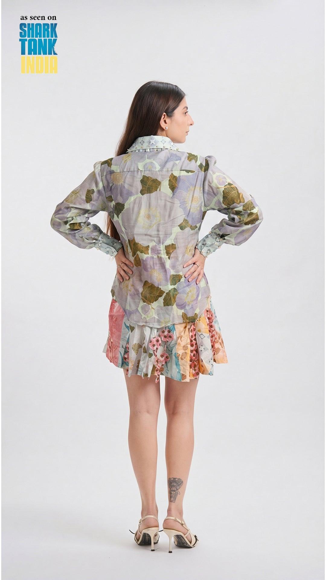 Woman wearing a colorful floral dress with a white background