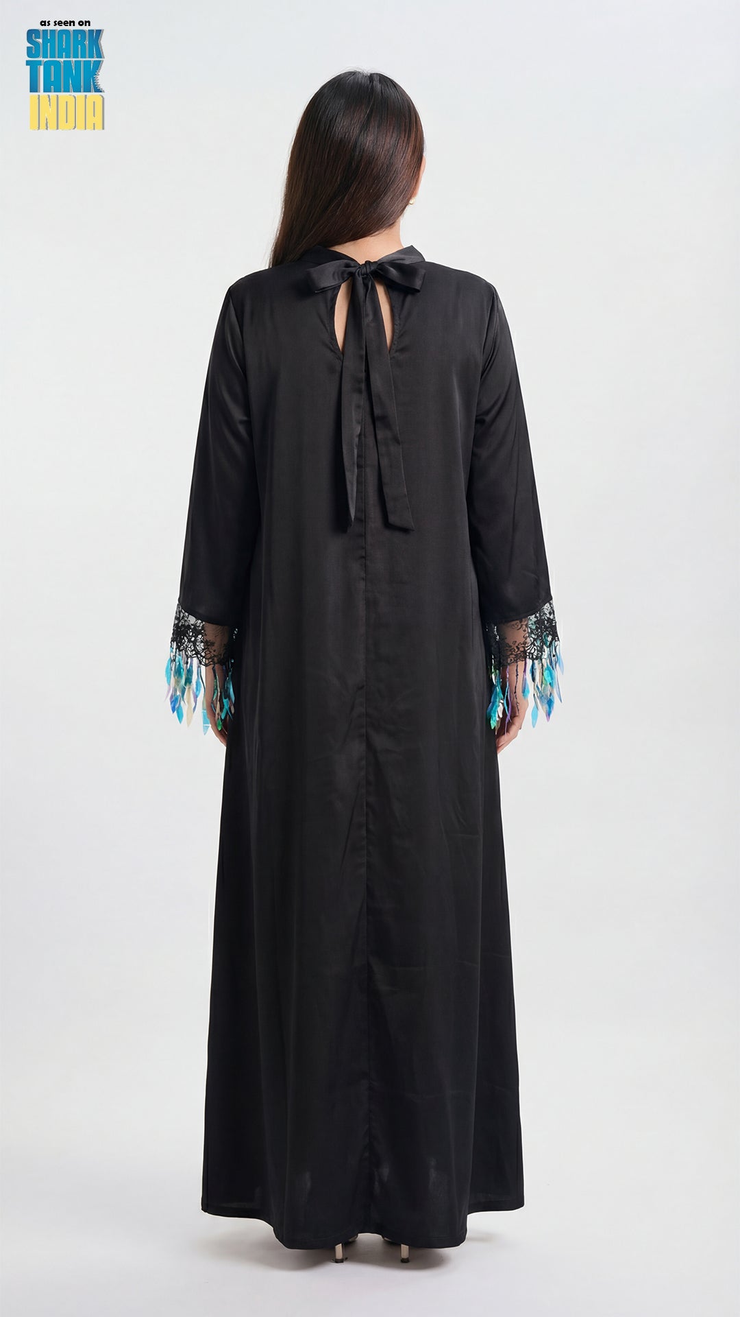 Black long dress with lace details on a white background