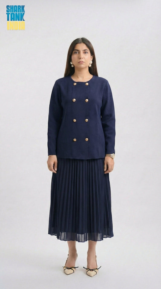 Woman wearing a navy blue outfit with a jacket and pleated skirt on a white background
