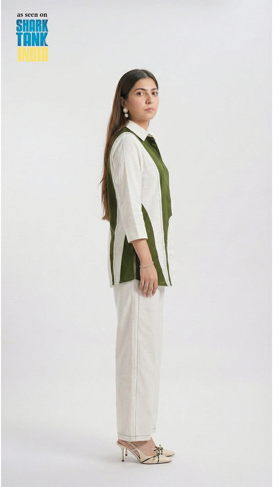 Woman wearing a green and white outfit on a white background