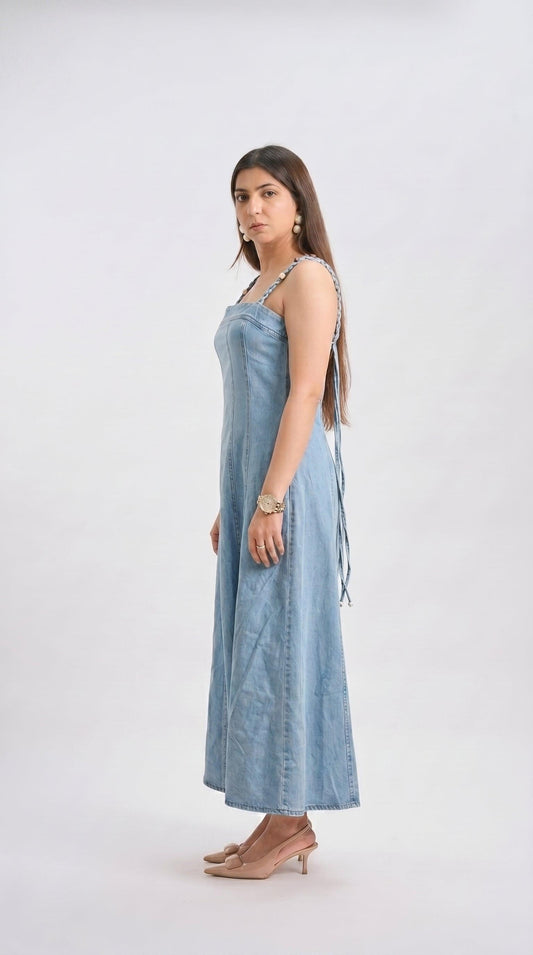 Woman wearing a light blue dress on a white background
