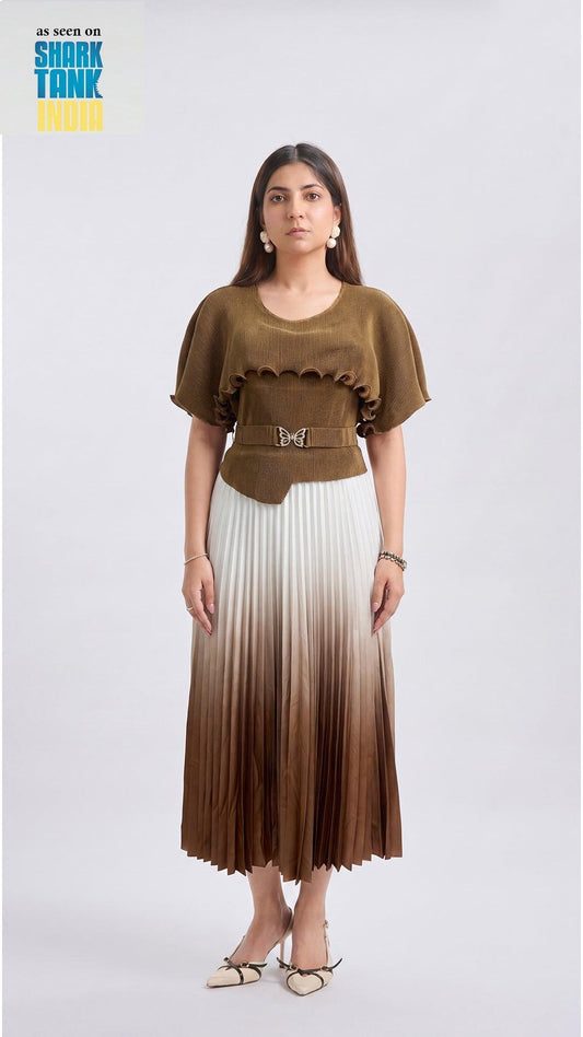 Woman wearing a brown top and gradient skirt on a white background