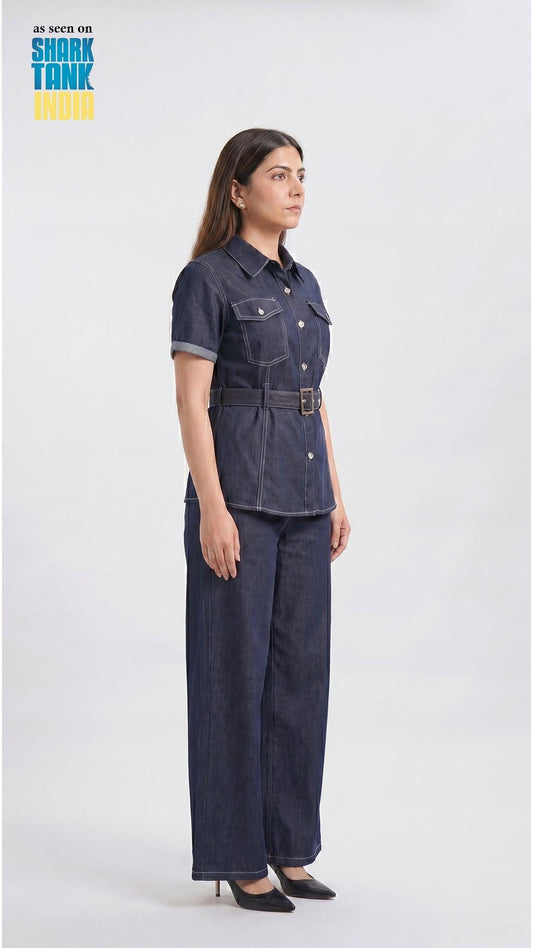 Woman wearing a denim outfit on a white background with 'Shark Tank' branding.