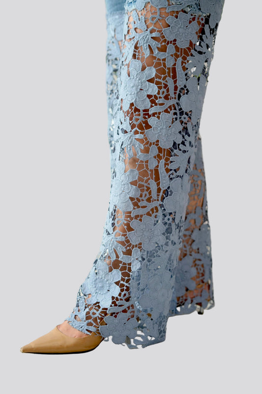 Light blue lace pants with a pattern on a white background