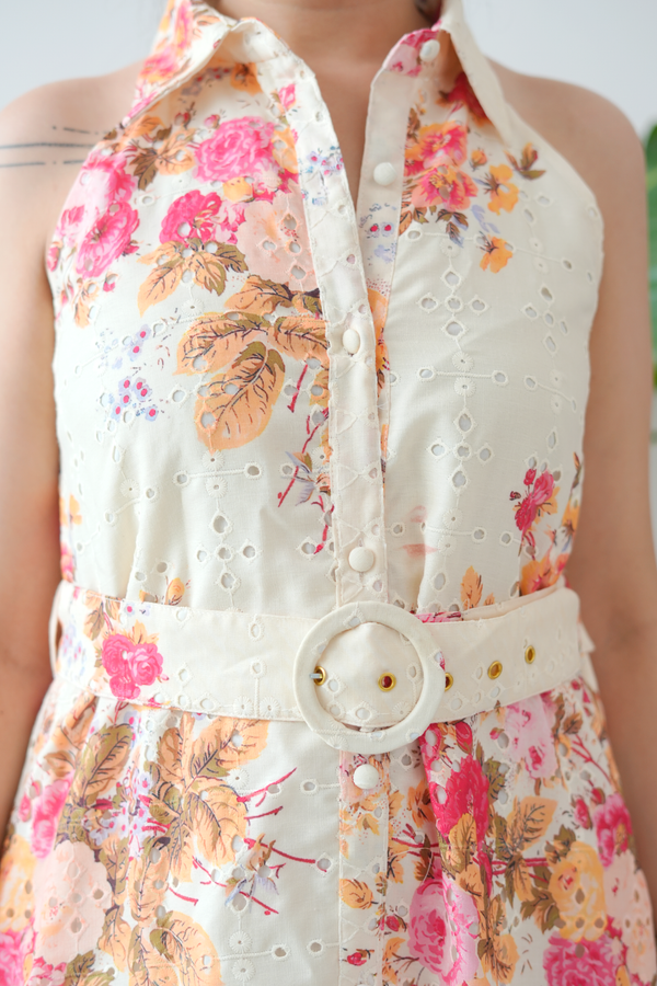 Floral dress with a belt on a blurred background
