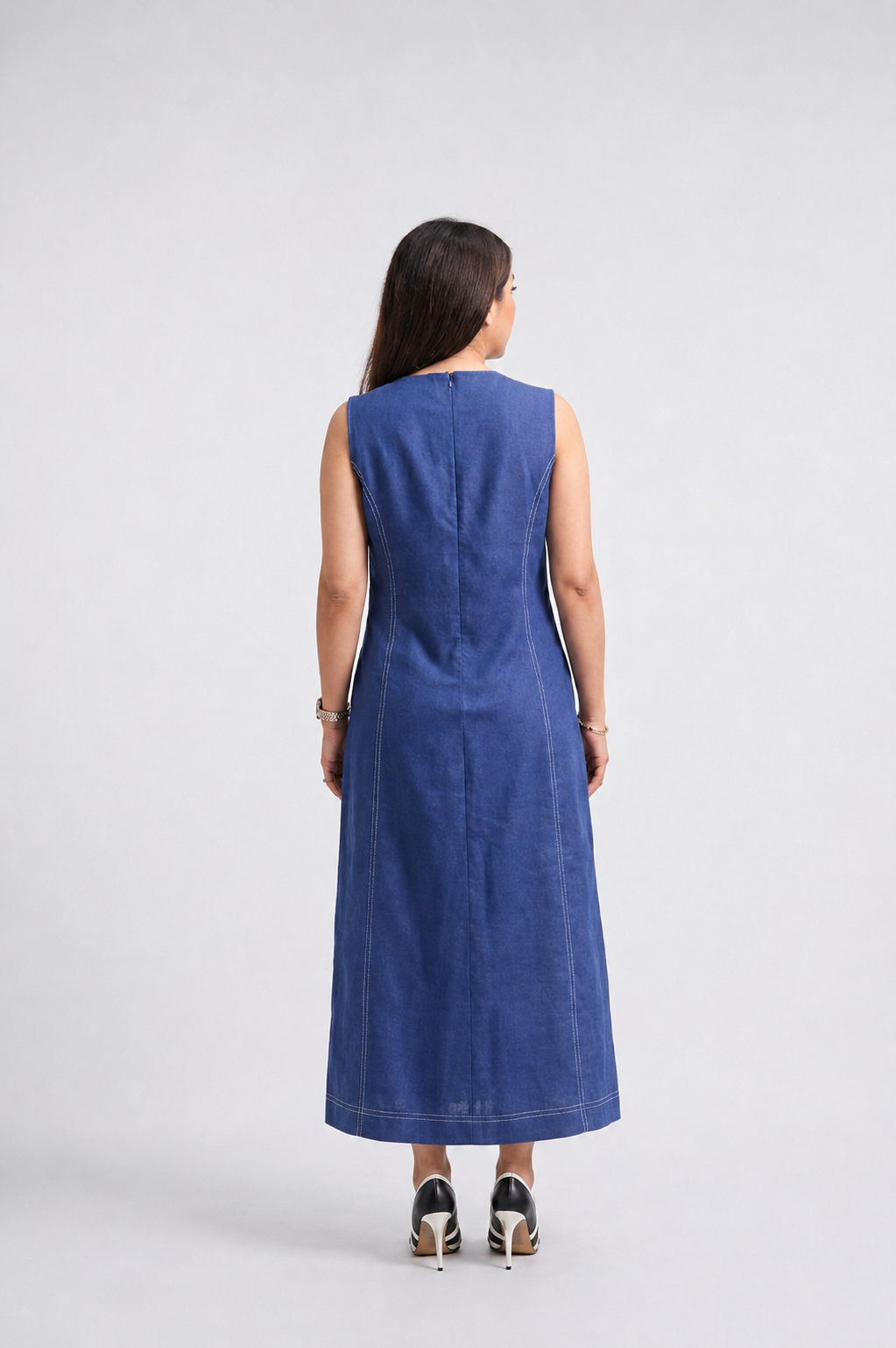 Woman wearing a blue dress on a white background