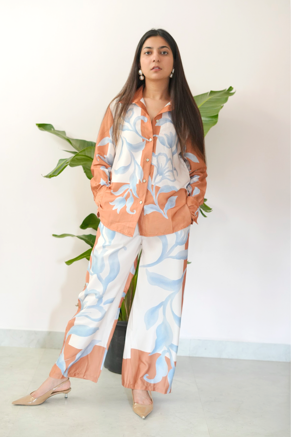 Woman wearing a floral outfit with a white background