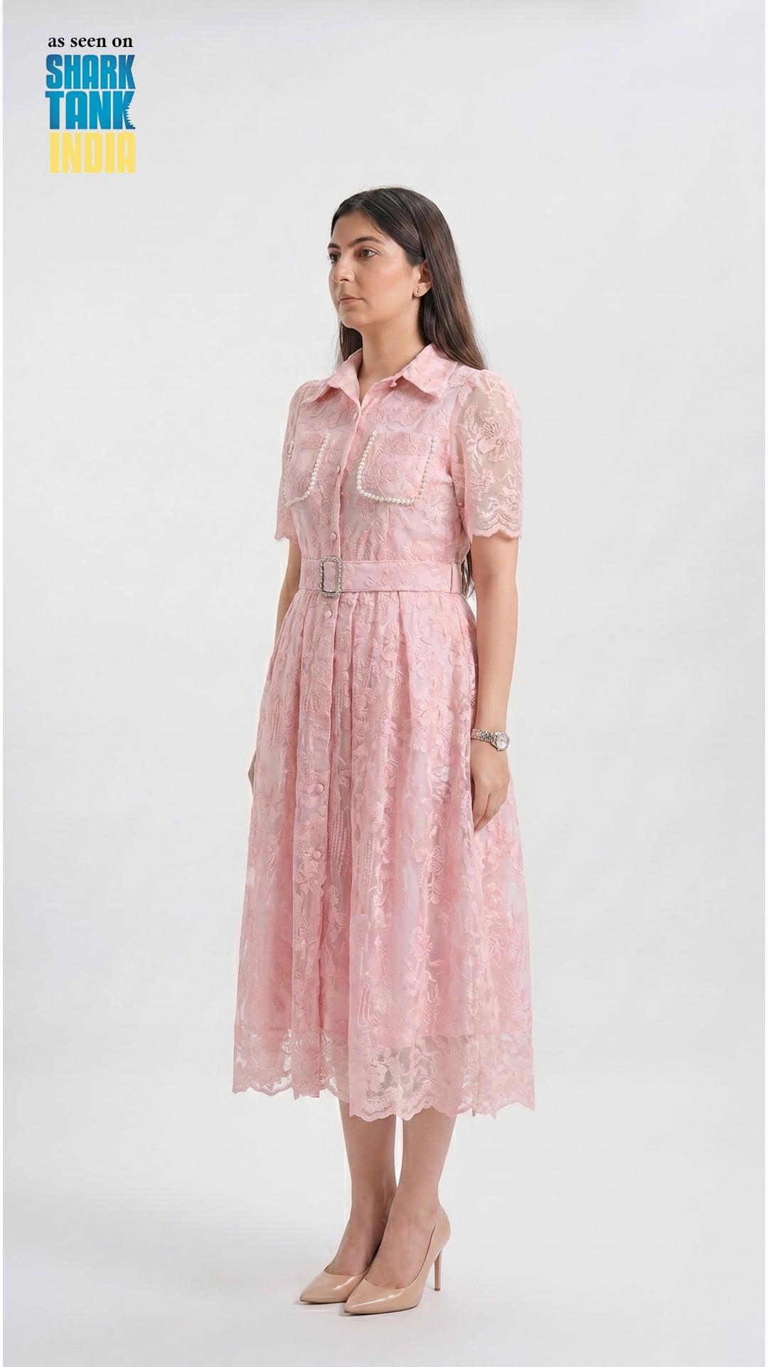 Woman wearing a pink lace dress on a white background with 'Shark Tank' branding.