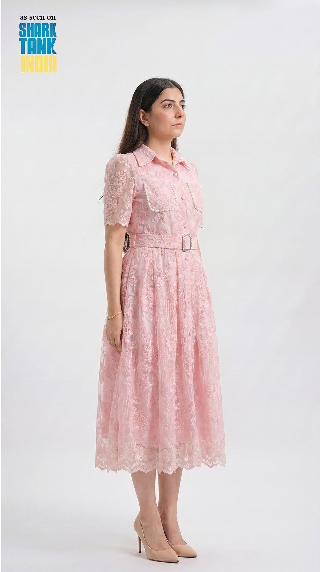 Woman wearing a pink lace dress on a white background with 'Shark Tank' branding.