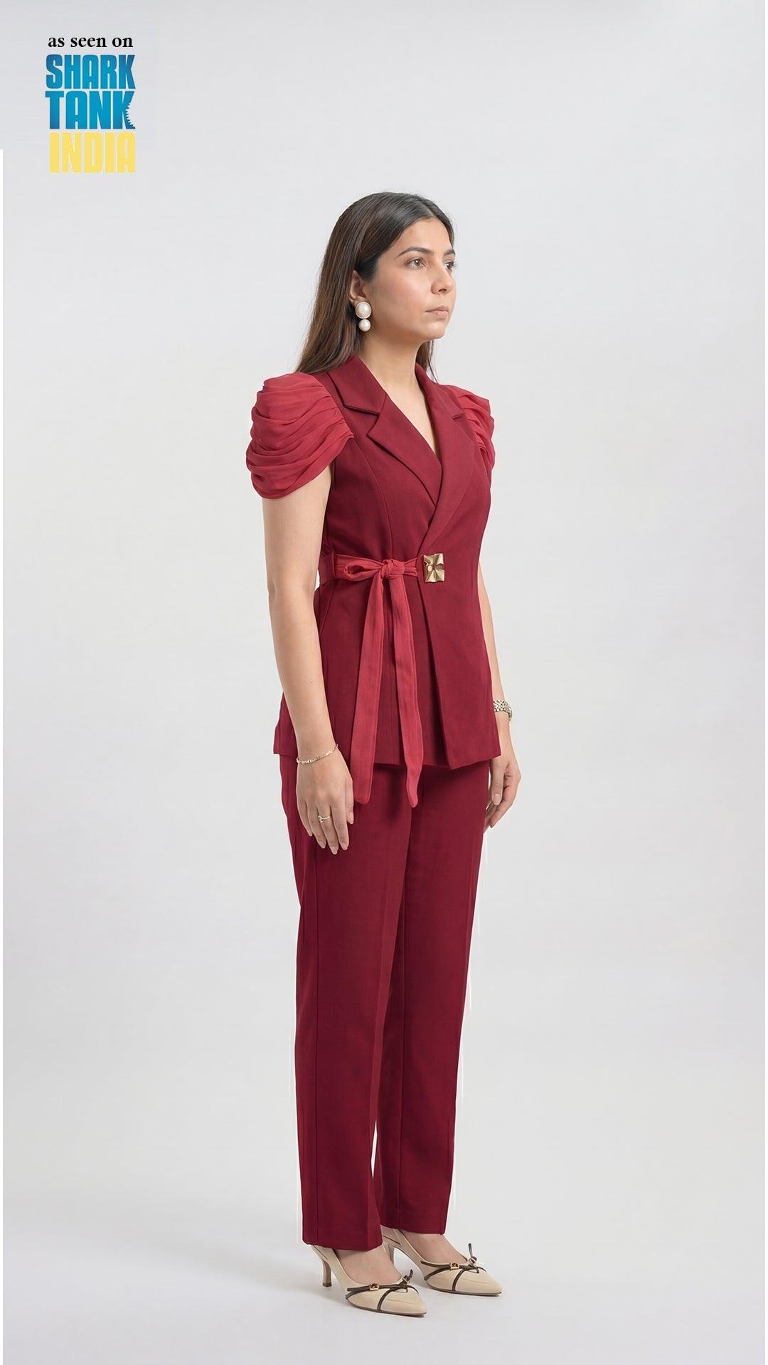 Woman wearing a red outfit with a belt on a white background