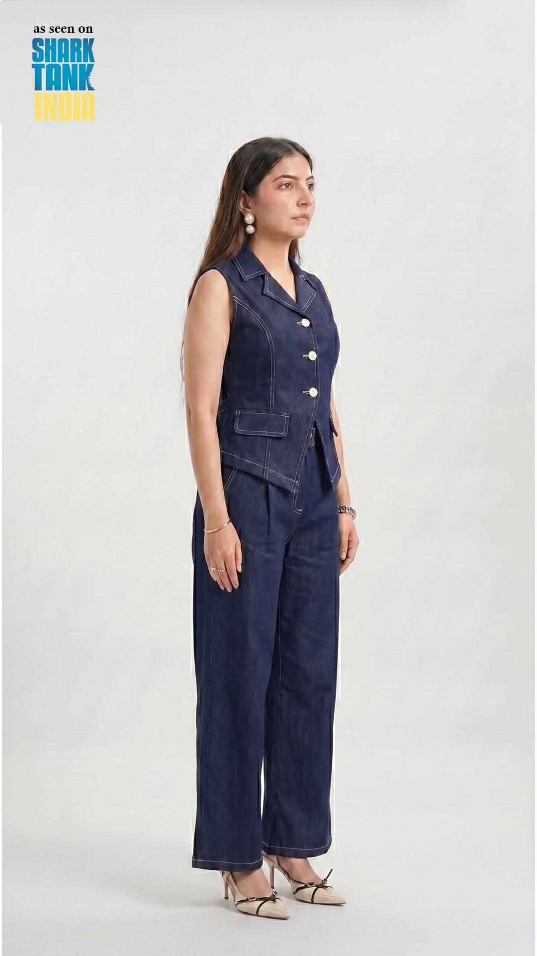 Woman wearing a denim jumpsuit on a white background with 'Shark Tank' branding.
