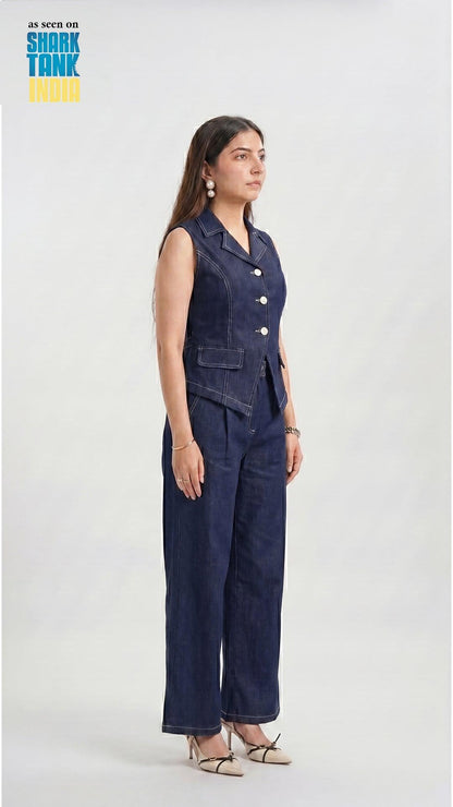 Woman wearing a denim jumpsuit on a white background with 'Shark Tank' branding.