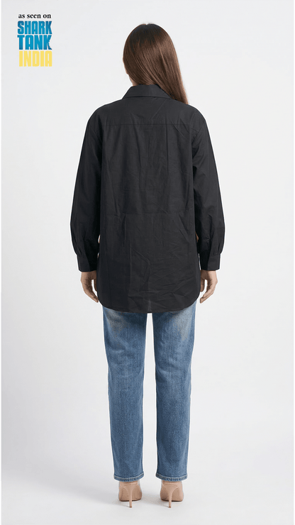 Person wearing a black jacket and blue jeans on a white background with 'Shark Tank' branding.