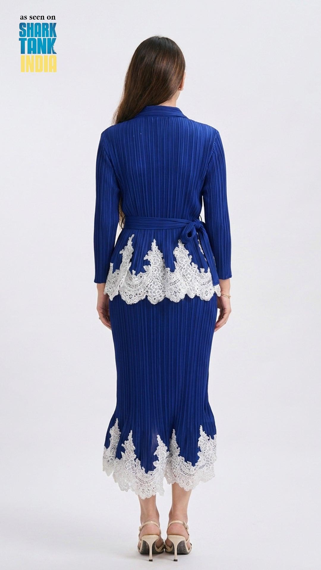 Woman wearing a blue dress with white lace details on a white background