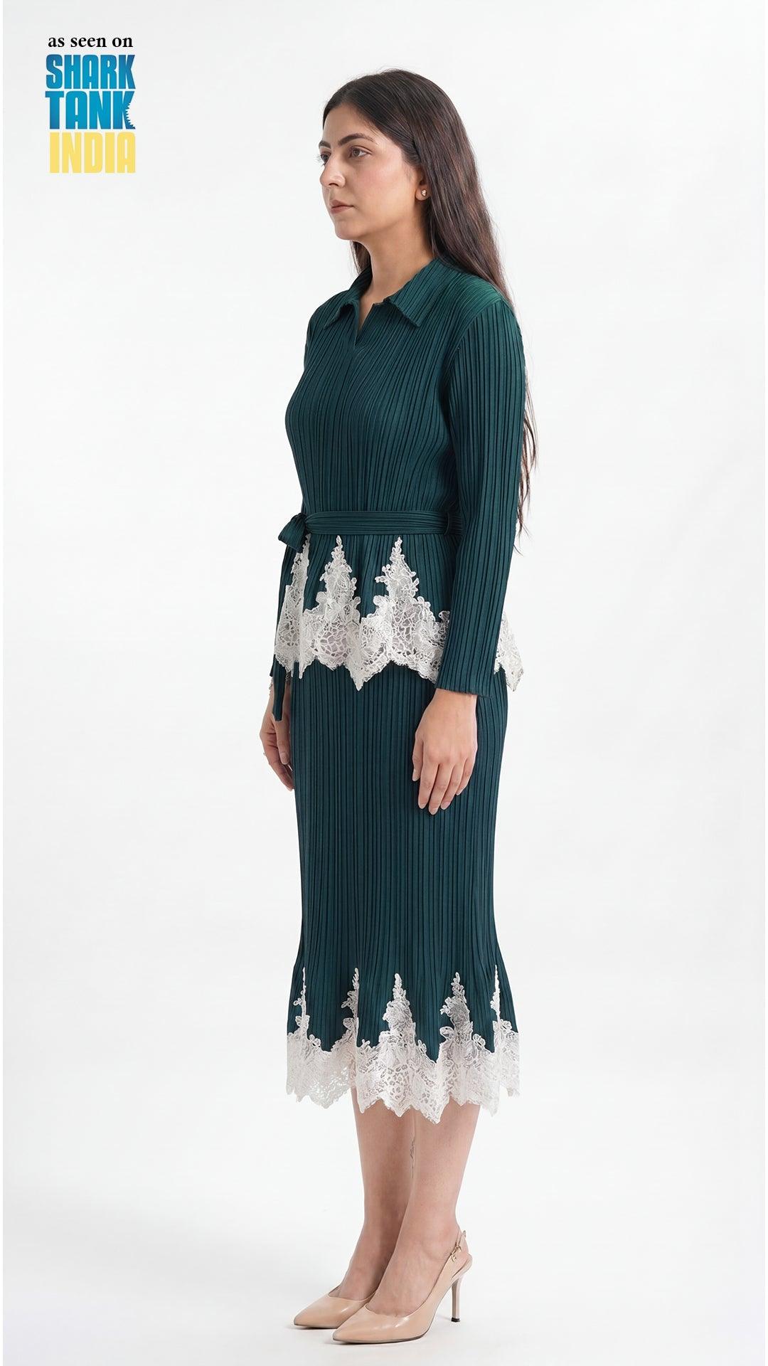 Woman wearing a green dress with white lace details on a white background