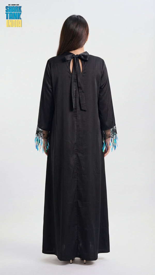 Black long dress with lace details on a white background