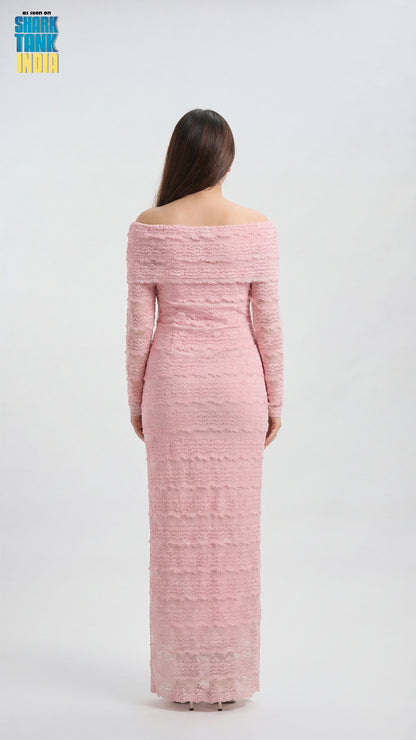 Woman wearing a pink off-shoulder dress on a white background