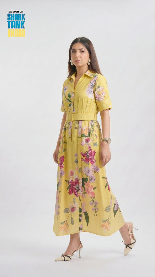Woman wearing a yellow floral dress on a white background with 'Shark Tank' branding.