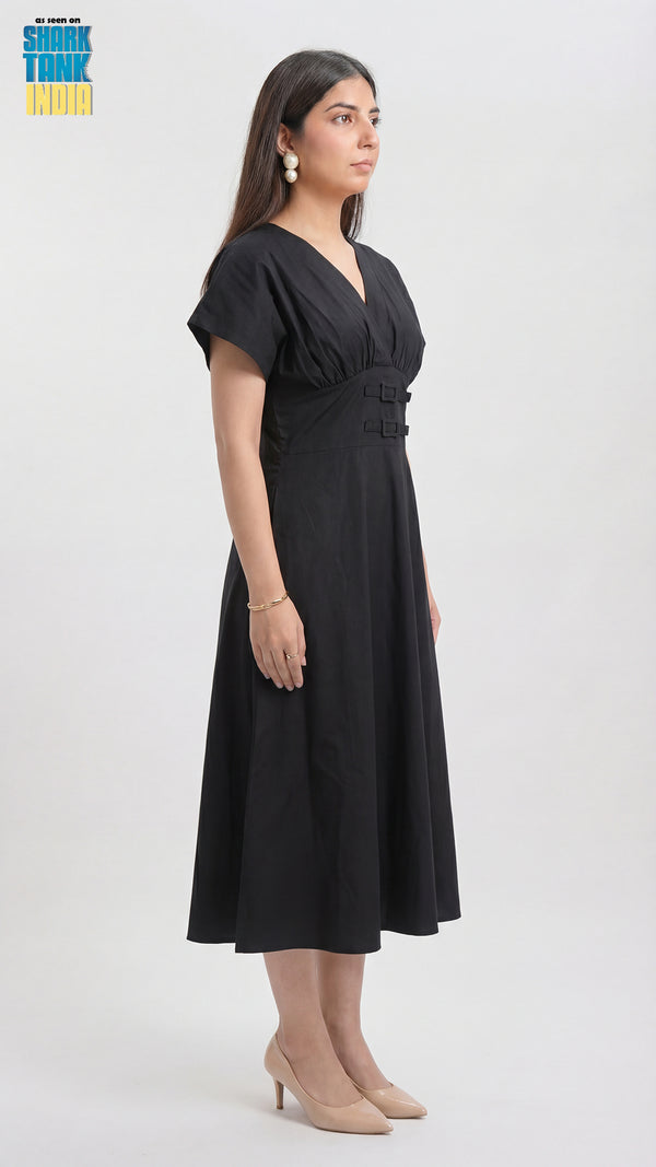 Woman wearing a black dress on a white background