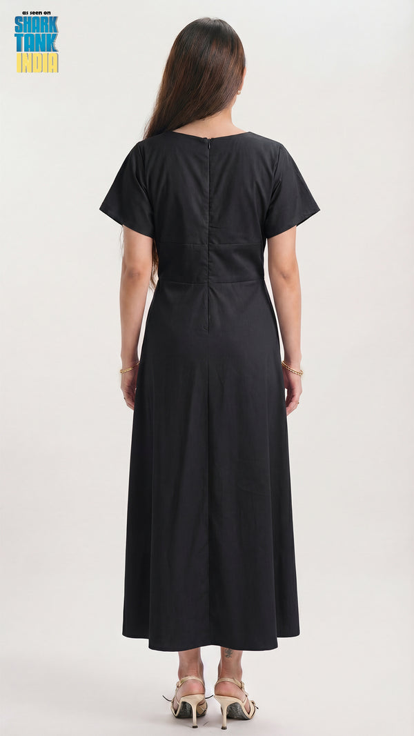 Black dress worn by a person on a white background