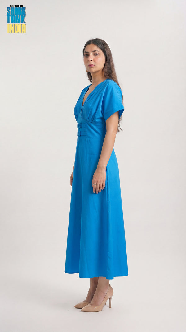 Woman wearing a blue dress on a white background