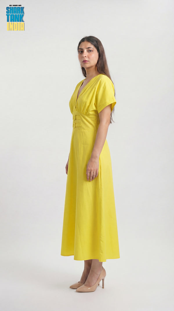 Woman wearing a yellow dress on a white background