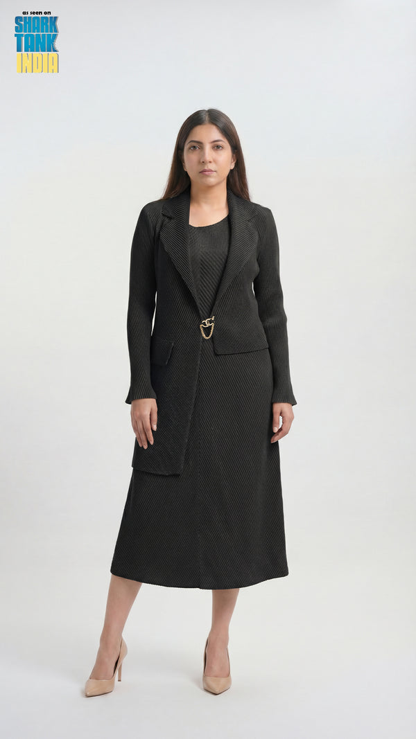 Woman wearing a black suit with a belt on a white background