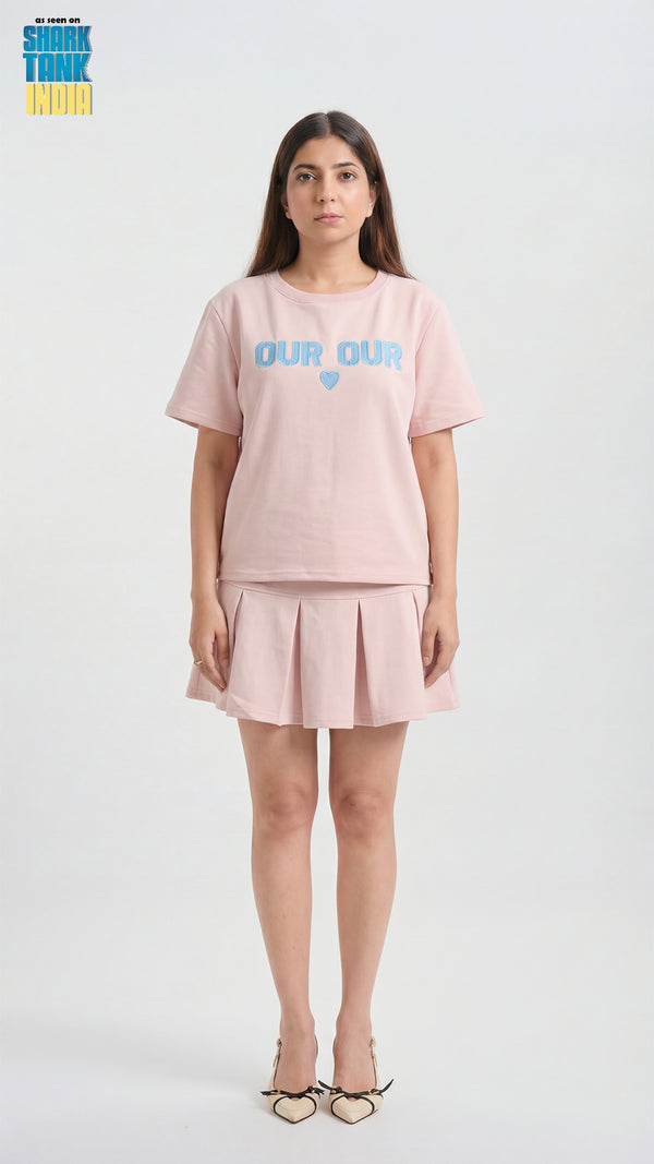 Woman wearing a pink outfit with 'Color Club' text on a white background