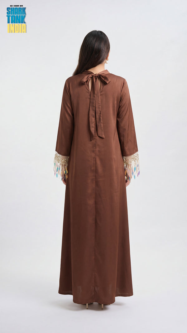 Brown dress with lace cuffs on a white background