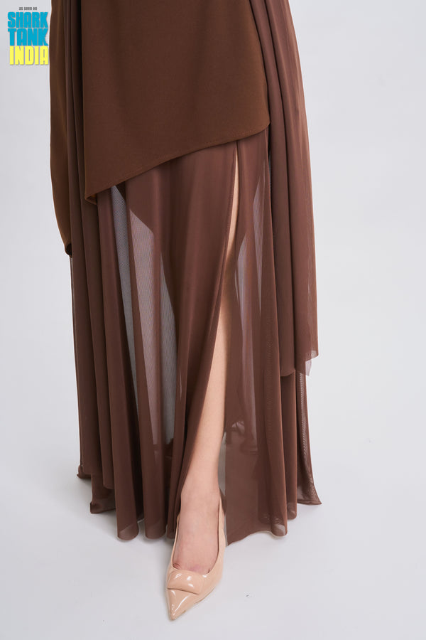 Brown dress with sheer overlay and beige high-heeled shoes on a white background