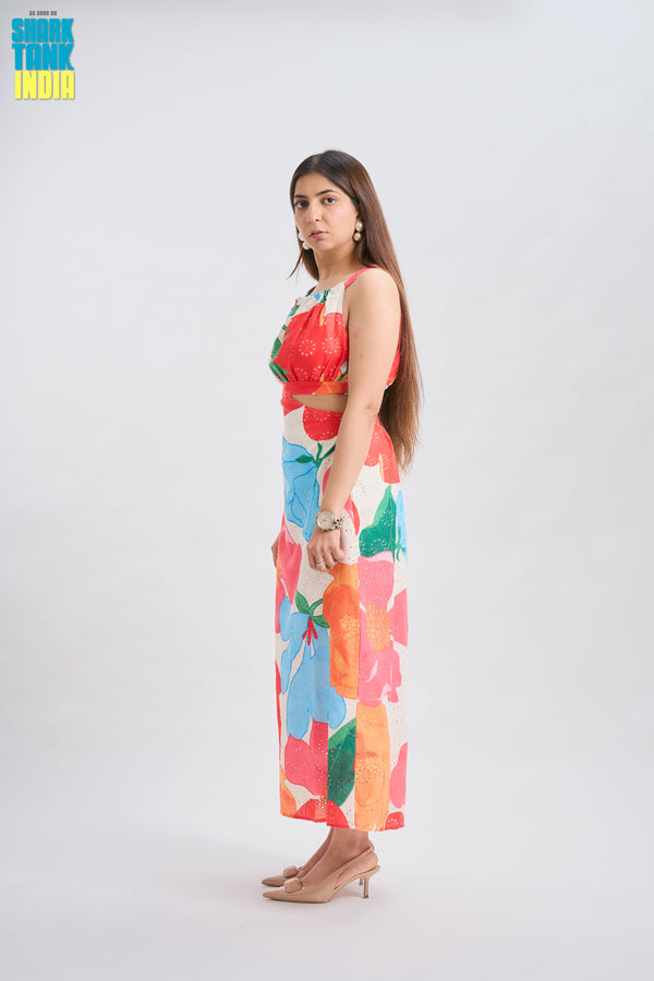 Woman wearing a colorful floral dress on a white background