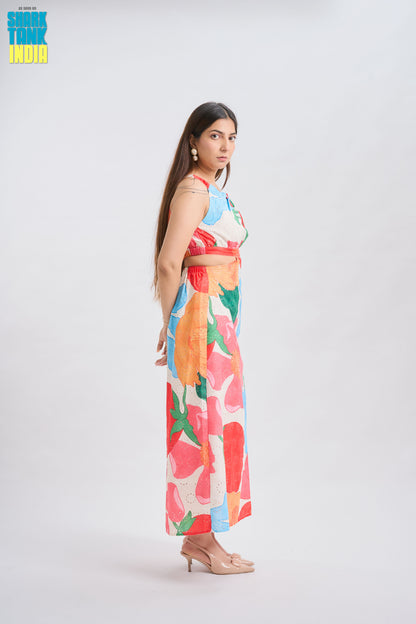 Woman wearing a colorful floral dress on a white background