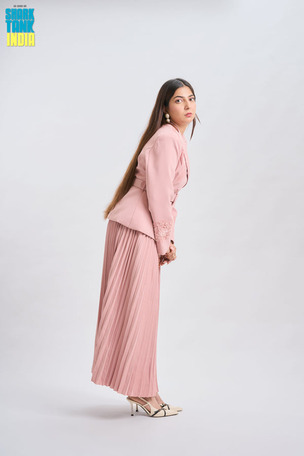 Woman wearing a pink outfit on a white background