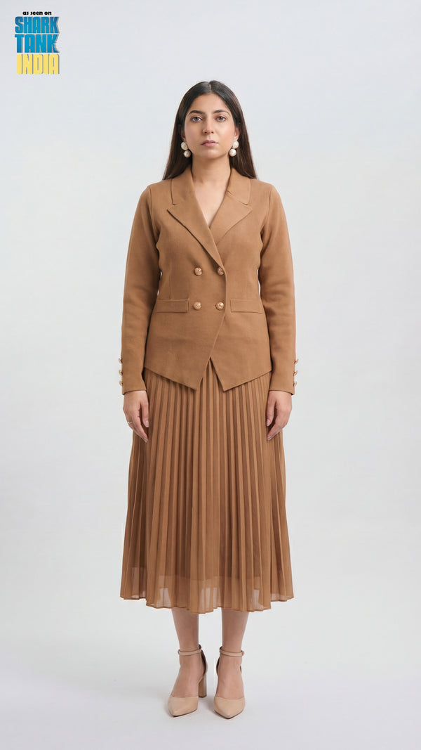Woman wearing a brown suit with a pleated skirt on a white background