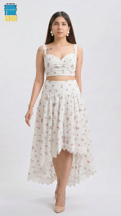 Woman wearing a white floral dress on a white background