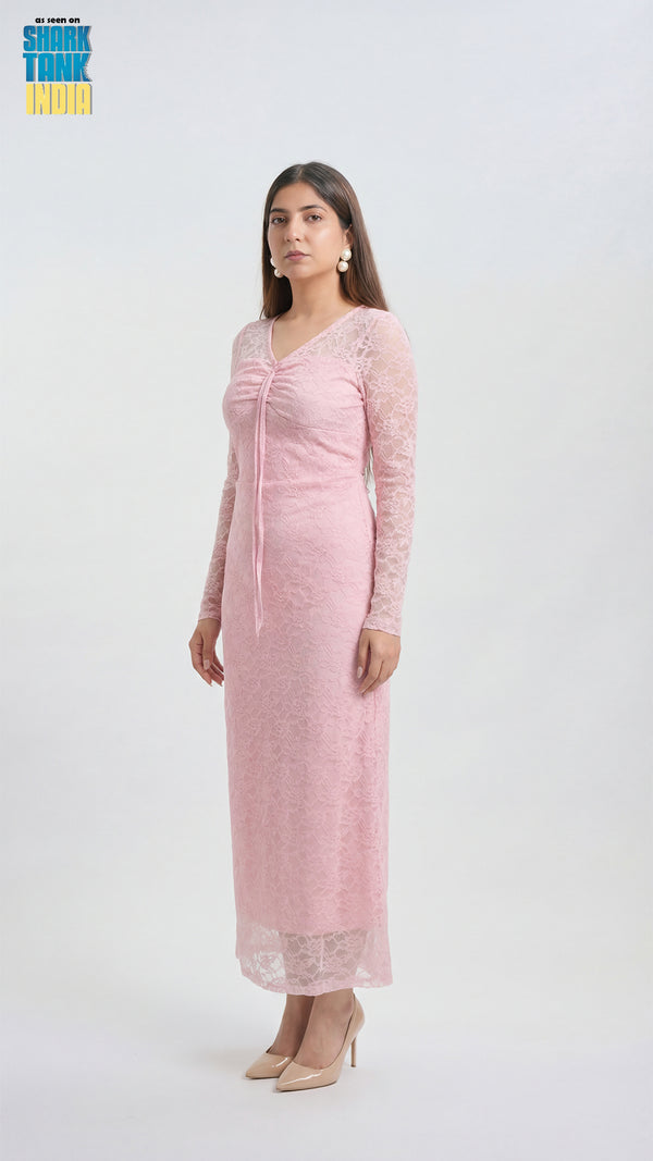 Woman wearing a pink lace dress on a white background