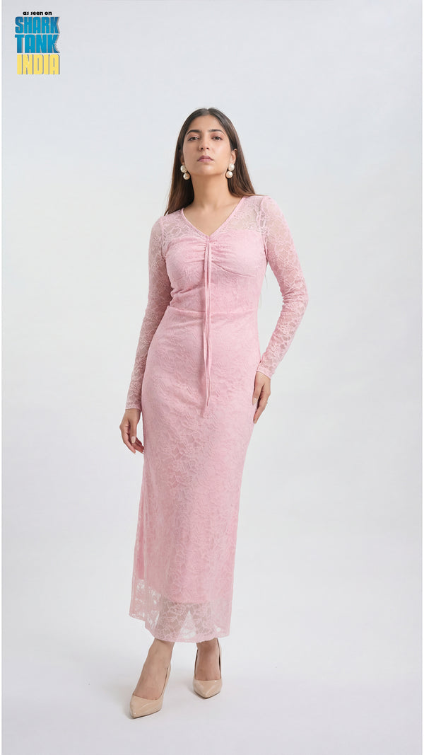 Woman wearing a pink lace dress on a white background