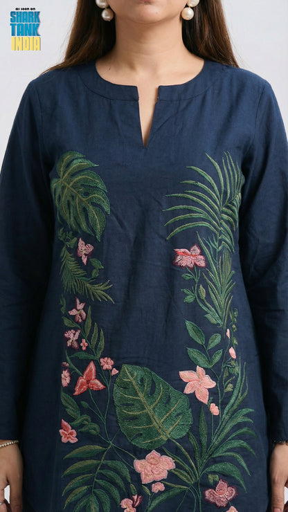 Navy blue kurta with floral and leaf embroidery worn by a person.