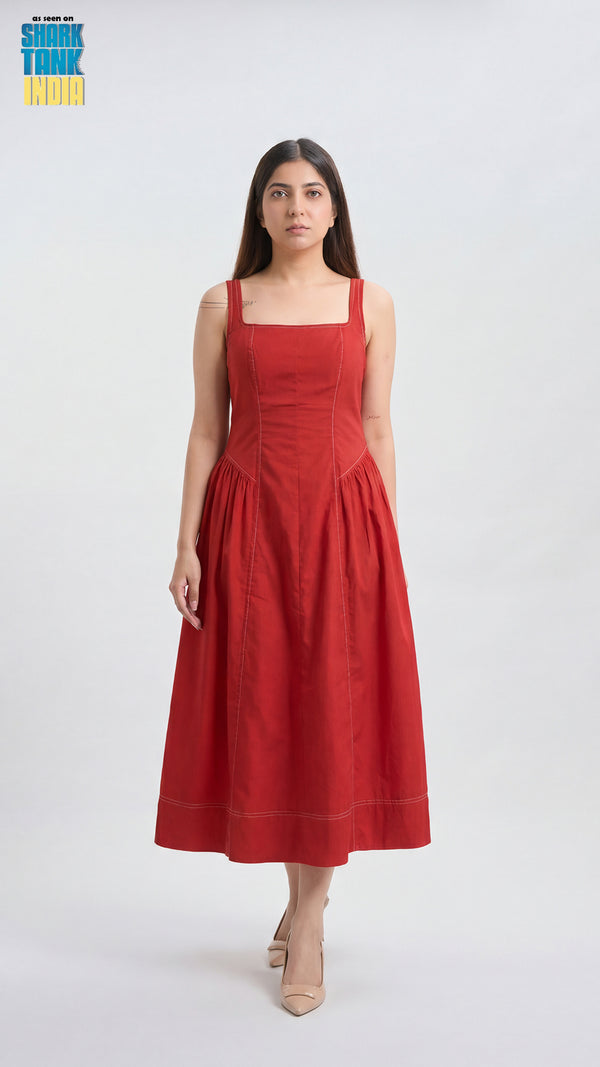 Woman wearing a red dress on a white background