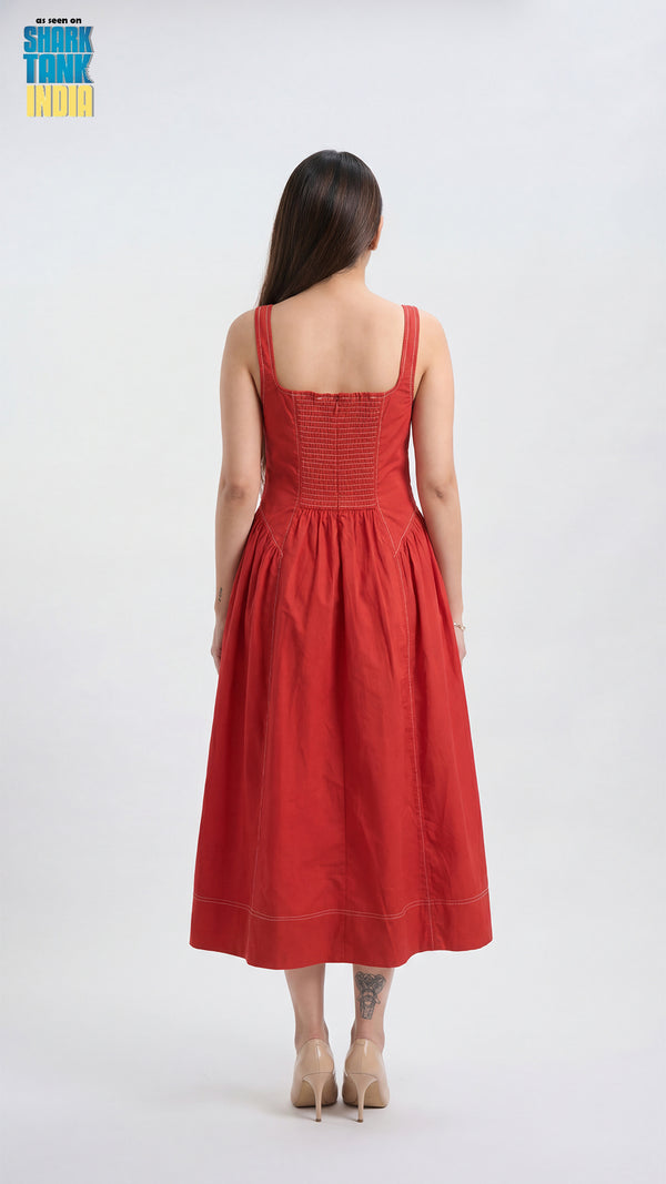 Woman wearing a red dress on a white background