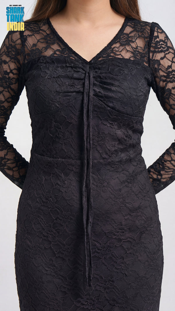 Black lace dress on a plain background