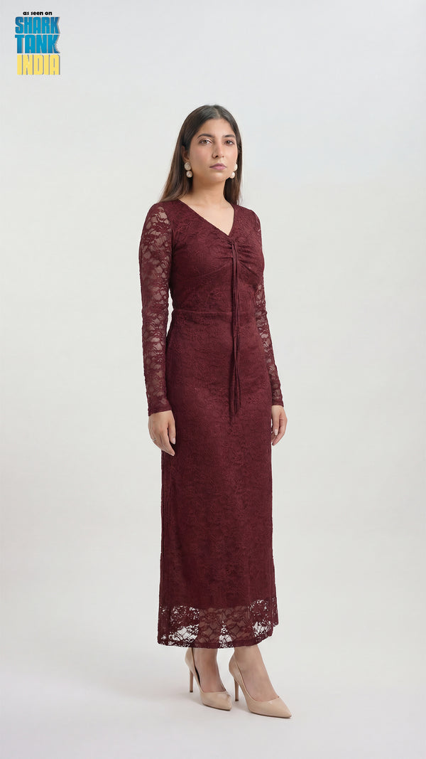 Woman wearing a burgundy lace dress on a white background