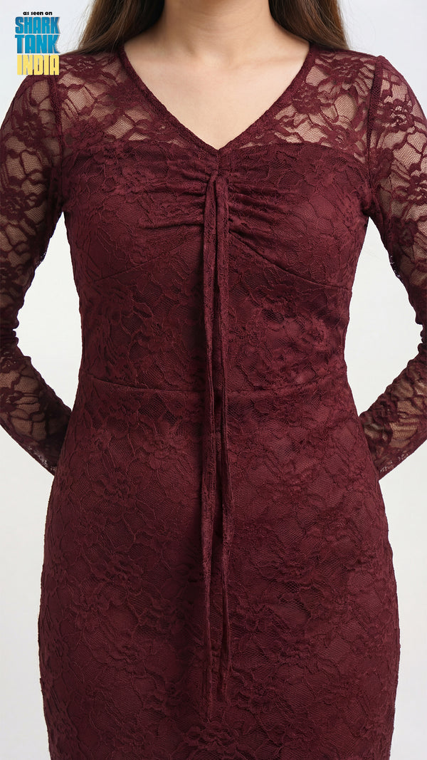 Maroon lace dress on a plain background
