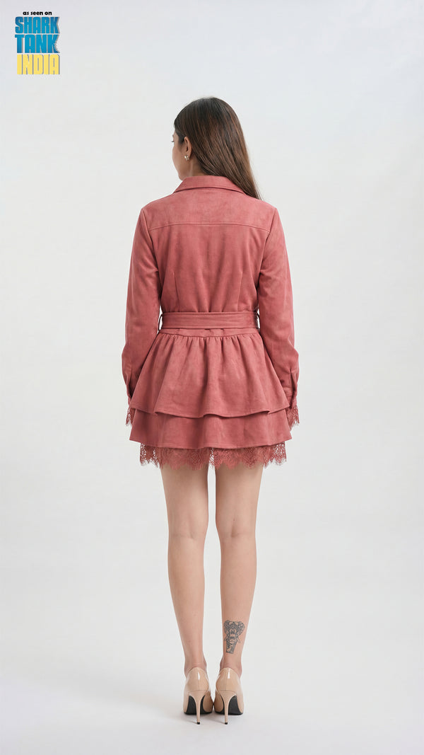 Person wearing a pink outfit with a white background