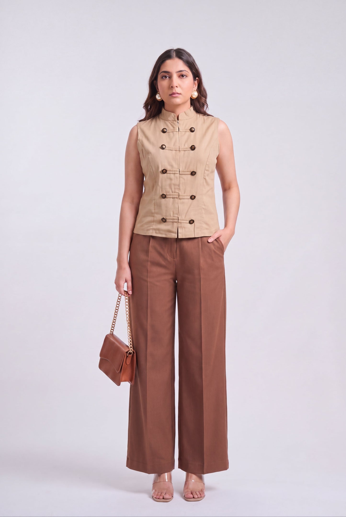 Tbfo Nepolian Top in beige with military-inspired metallic button detailing and high stand collar