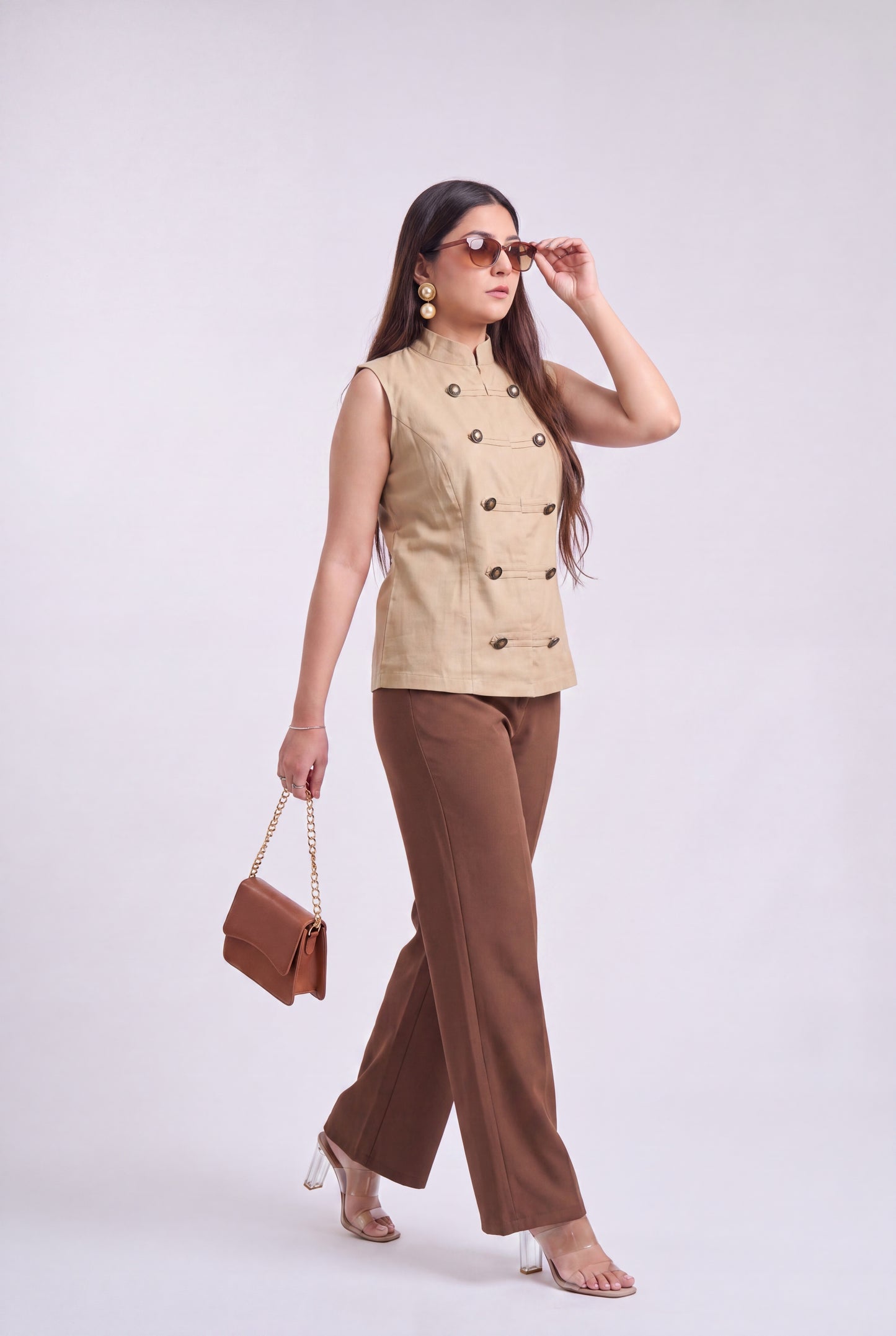 Tbfo Nepolian Top in beige with military-inspired metallic button detailing and high stand collar