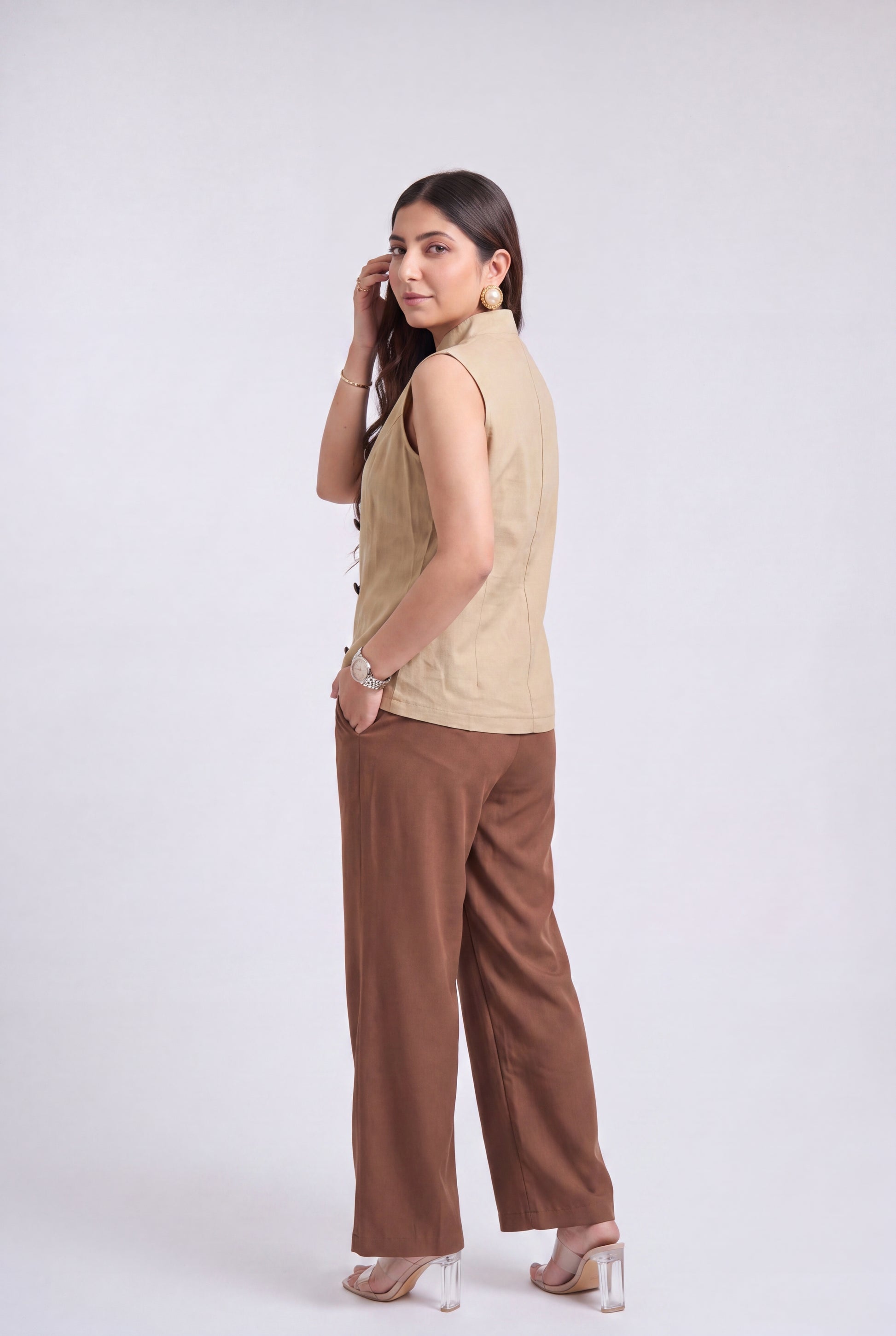 Tbfo Nepolian Top in beige with military-inspired metallic button detailing and high stand collar