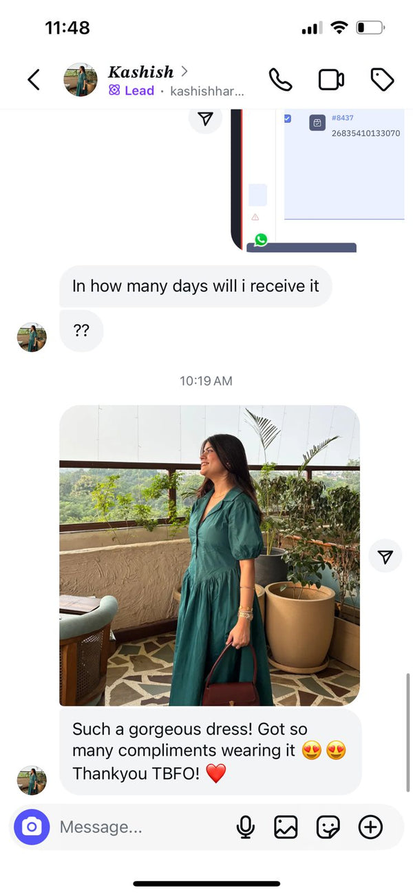 Phone screen showing a chat conversation with a person in a green dress on a balcony.