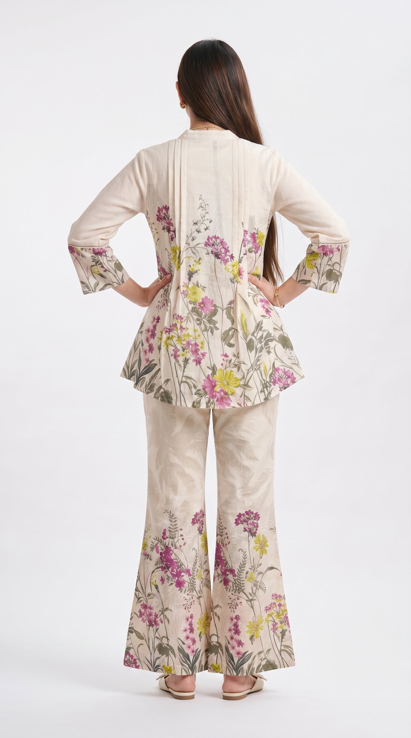 Woman wearing a floral outfit on a white background