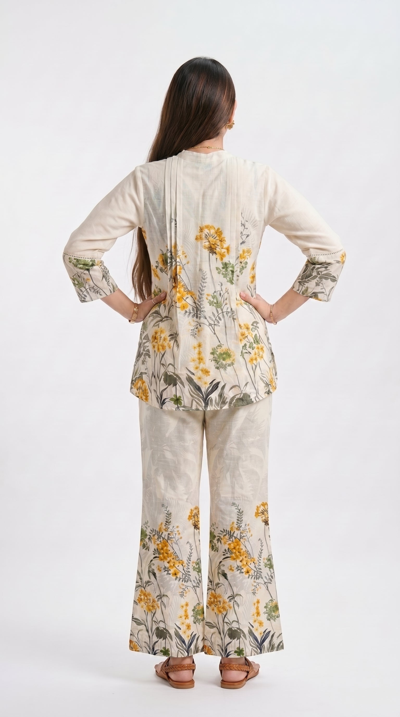 Woman wearing a floral outfit on a white background